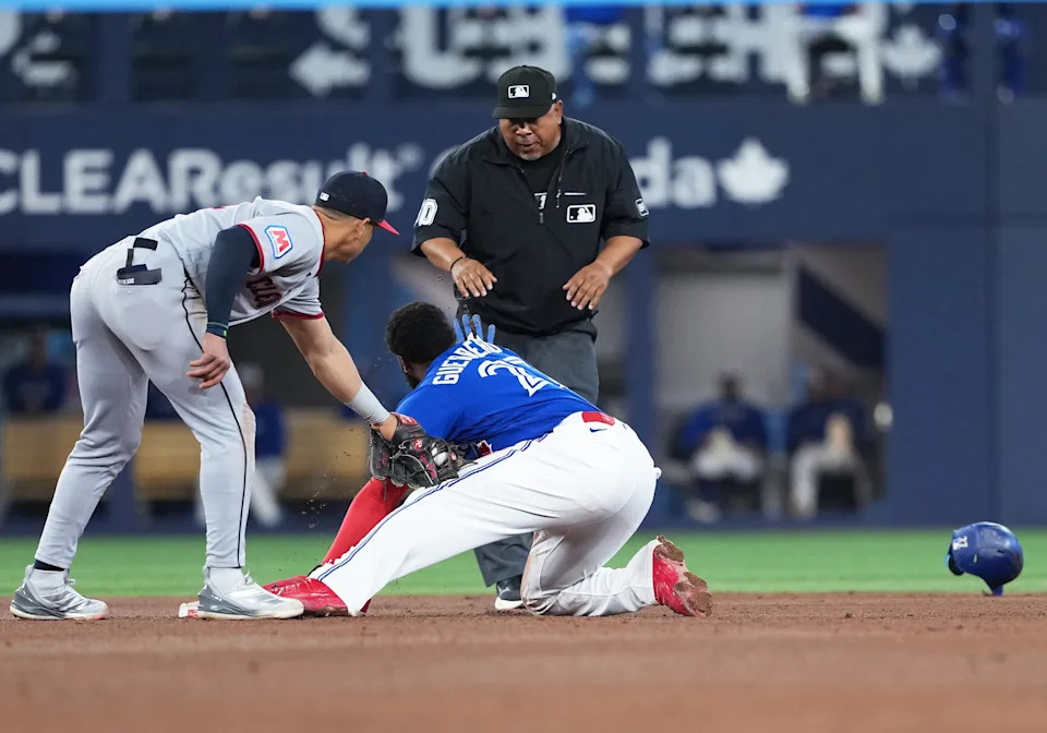 Apr 25, 2026; Toronto, Ontario, CAN; Toronto Blue Jays first baseman Vladimir Guerrero Jr. (27) is safe at second base ahead of the tag from Cleveland Guardians second baseman Juan Brito (34) during the sixth inning at Rogers Centre. Mandatory Credit: Nick Turchiaro-Imagn Images
