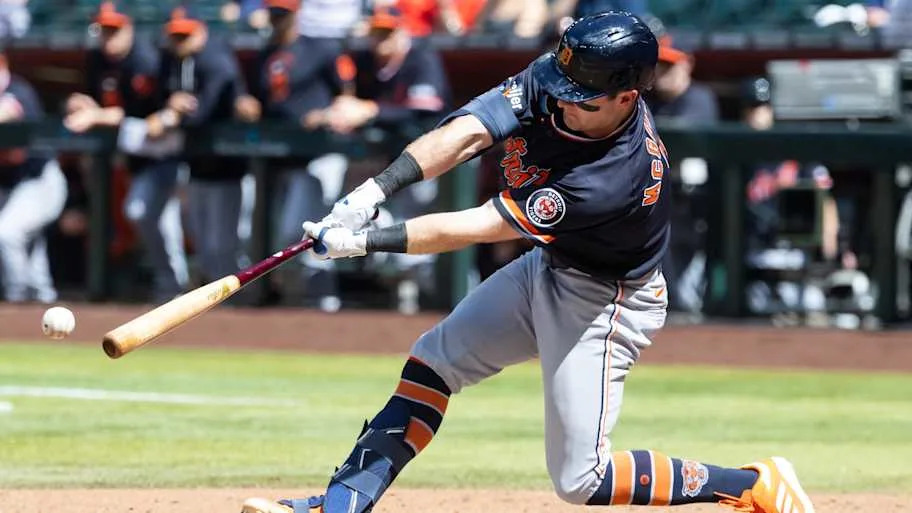 Kevin McGonigle hits a triple against the Diamondbacks in a black Tigers jerse