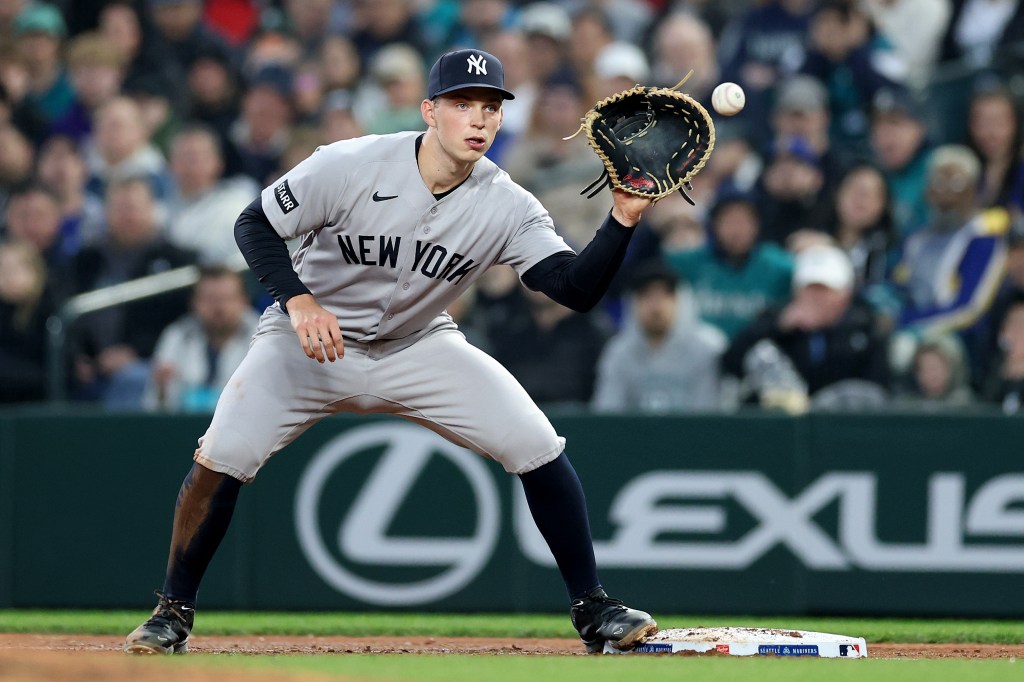 Ben Rice #22 of the New York Yankees fields the ball against the Seattle Mariners at T-Mobile Park on March 31, 2026 in Seattle, Washington. 
