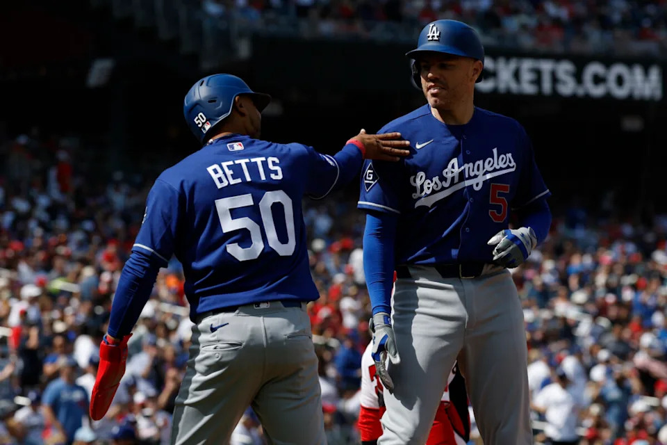 Apr 3, 2026; Washington, District of Columbia, USA; Los Angeles Dodgers first baseman Freddie Freeman (5) celebrates with Dodgers shortstop Mookie Betts (50) after hitting a two run home run against the Washington Nationals during the fifth inning at Nationals Park. Mandatory Credit: Geoff Burke-Imagn Images