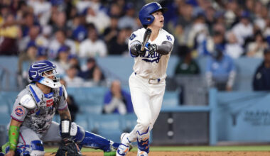 Kim Hye-seong of the Los Angeles Dodgers, right, hits a two-run home run against the New York Mets during the clubs