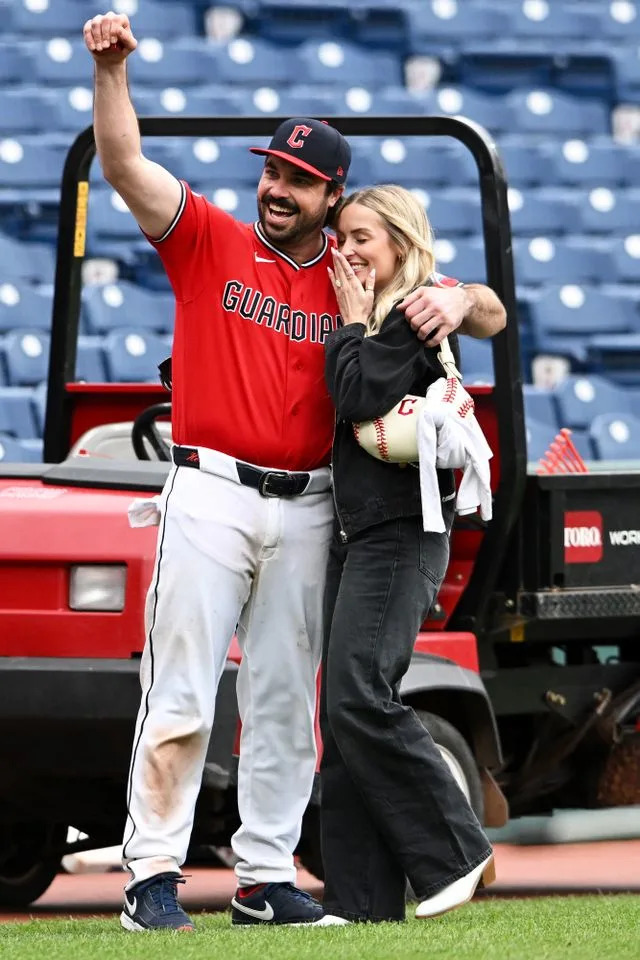 Austin Hedges proposes to girlfriend Lexi Dickinson on the fieldCredit: Nick Cammett/Getty