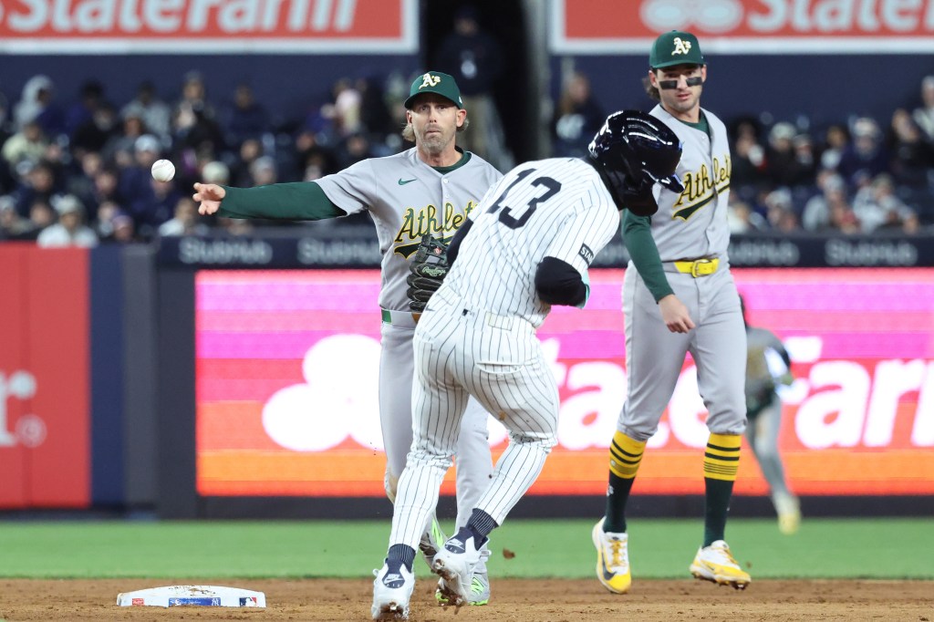 Second baseman Jeff McNeil throws to first to complete a double play after orcing out Jazz Chisholm Jr. during the sixth inning of the Yankees' 5-3 win over the A's on April 7, 2026 at the Stadium.
