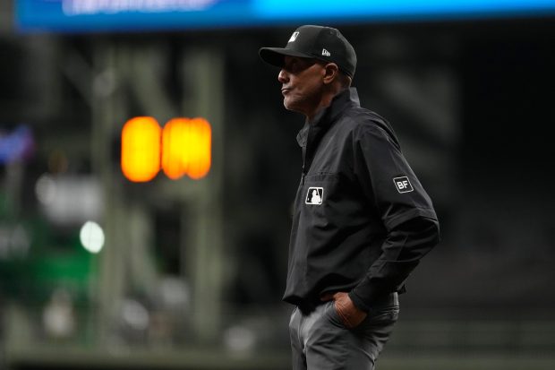 Umpire CB Bucknor looks on during the eighth inning of a baseball game between the Milwaukee Brewers and the Tampa Bay Rays, Tuesday, March 31, 2026, in Milwaukee. (AP Photo/Aaron Gash)
