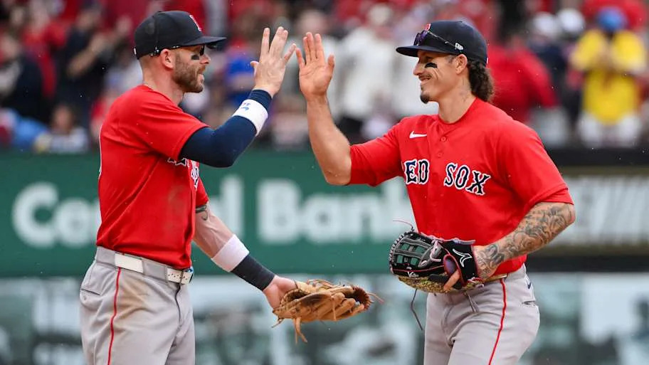 Boston Red Sox shortstop Trevor Story (10) and left fielder Jarren Duran