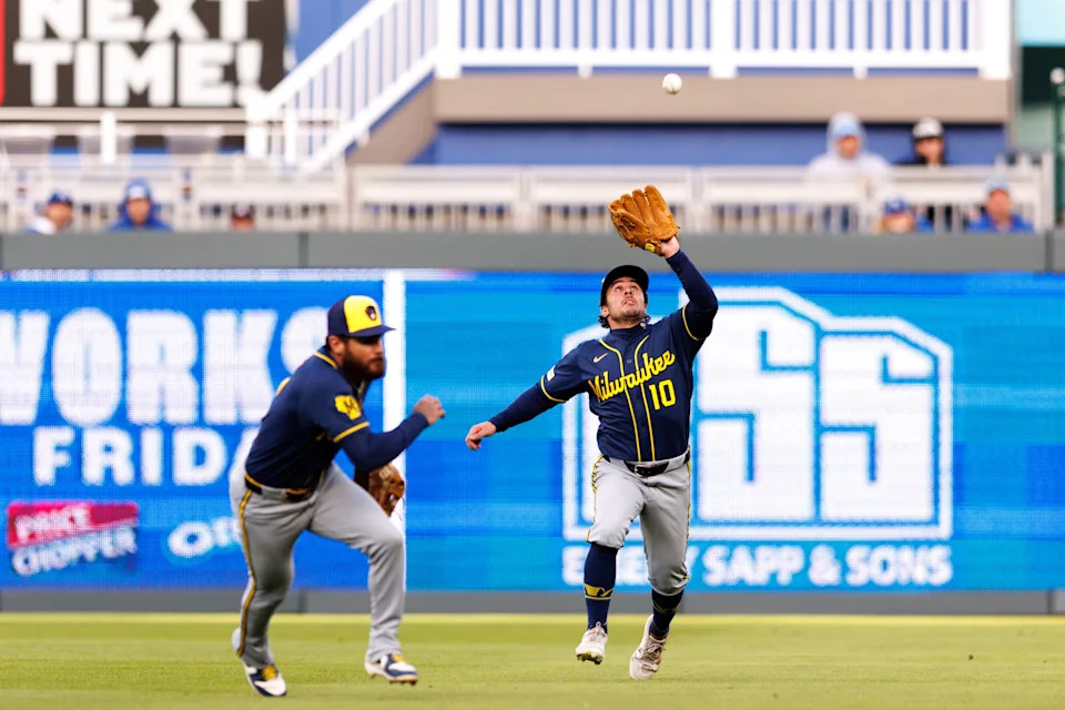 Brewers right fielder Sal Frelick reaches for a fly ball during the first game of a doubleheader against the Royals on April 5 in Kansas City. He was injured in the second game.