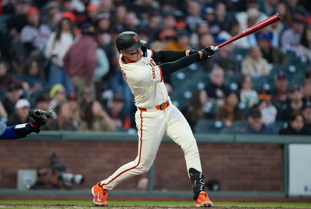 Daniel Susac of the San Francisco Giants swings to hit a single against the New York Mets.