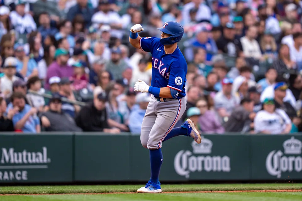 Apr 18, 2026; Seattle, Washington, USA; <a class="link " href="https://sports.yahoo.com/mlb/teams/texas/" data-i13n="sec:content-canvas;subsec:anchor_text;elm:context_link" data-ylk="slk:Texas Rangers;sec:content-canvas;subsec:anchor_text;elm:context_link;itc:0" data-yga="{"yLinkElement":"context_link","yModuleName":"content-canvas","yLinkText":"Texas Rangers","ySubModuleName":"anchor_text","yHasCommerce":false}">Texas Rangers</a> third baseman <a class="link " href="https://sports.yahoo.com/mlb/players/11850/" data-i13n="sec:content-canvas;subsec:anchor_text;elm:context_link" data-ylk="slk:Josh Jung;sec:content-canvas;subsec:anchor_text;elm:context_link;itc:0" data-yga="{"yLinkElement":"context_link","yModuleName":"content-canvas","yLinkText":"Josh Jung","ySubModuleName":"anchor_text","yHasCommerce":false}">Josh Jung</a> (6) rounds the bases after hitting a solo home run during the sixth inning against the <a class="link " href="https://sports.yahoo.com/mlb/teams/seattle/" data-i13n="sec:content-canvas;subsec:anchor_text;elm:context_link" data-ylk="slk:Seattle Mariners;sec:content-canvas;subsec:anchor_text;elm:context_link;itc:0" data-yga="{"yLinkElement":"context_link","yModuleName":"content-canvas","yLinkText":"Seattle Mariners","ySubModuleName":"anchor_text","yHasCommerce":false}">Seattle Mariners</a> at T-Mobile Park. Mandatory Credit: Stephen Brashear-Imagn Images | Stephen Brashear-Imagn Images