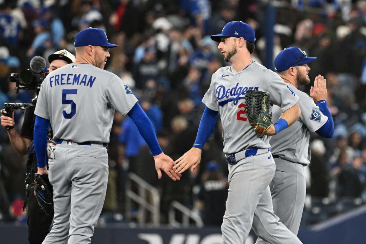 Apr 7, 2026; Toronto, Ontario, CAN; Los Angeles Dodgers right fielder Kyle Tucker (23) celebrates with first baseman Freddie Freeman (5) after a win over the Toronto Blue Jays at Rogers Centre. Mandatory Credit: Dan Hamilton-Imagn Images