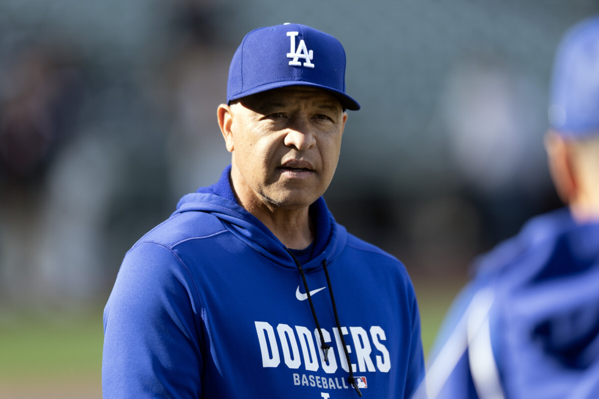 Apr 21, 2026; San Francisco, California, USA; Los Angeles Dodgers manager Dave Roberts (30) chats with a coach before a game against the San Francisco Giants at Oracle Park. Mandatory Credit: D. Ross Cameron-Imagn Images