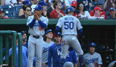 Apr 4, 2026; Washington, District of Columbia, USA; Los Angeles Dodgers shortstop Mookie Betts (50) is congratulated by teammates after scoring a run against the Washington Nationals during the first inning at Nationals Park. Mandatory Credit: Brad Mills-Imagn Images