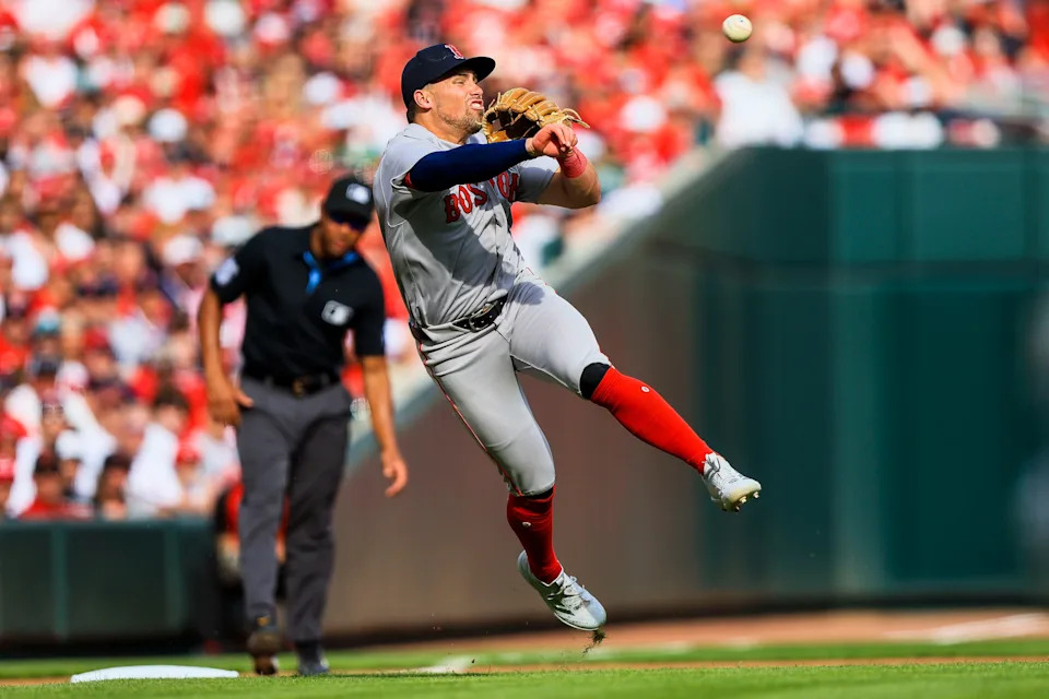 Boston Red Sox third baseman Caleb Durbin throws to first to get Cincinnati Reds first baseman Sal Stewart out in the fourth inning of a game March 26, 2026, at Great American Ball Park in Cincinnati.