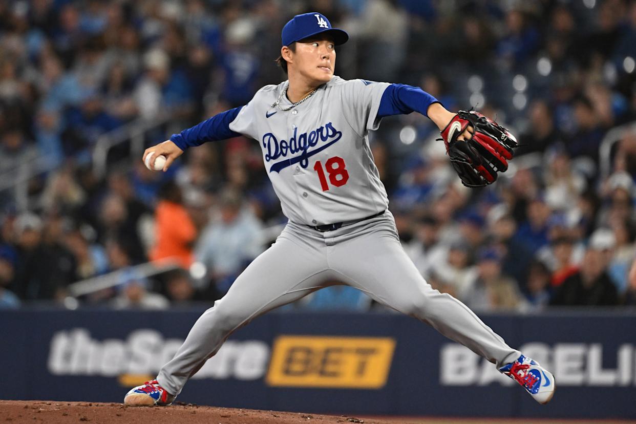 Apr 7, 2026; Toronto, Ontario, CAN; Los Angeles Dodgers starting pitcher Yoshinobu Yamamoto (18) delivers a pitch against the Toronto Blue Jays in the first inning at Rogers Centre. Mandatory...