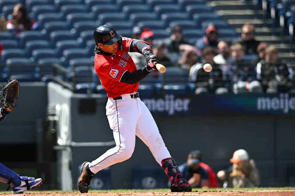Cleveland Guardians rookie Juan Brito hits a double for his first career hit during the second inning of his Major League debut against the Kansas City Royals on April 7, 2026, in Cleveland.