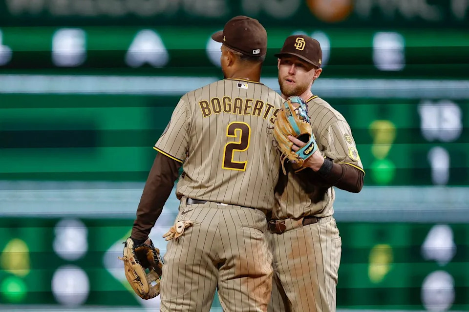 Xander Bogaerts #2 and Jake Cronenworth #9 celebrate a team victory over the Pirates at PNC Park on April 6, 2025 in Pittsburgh.