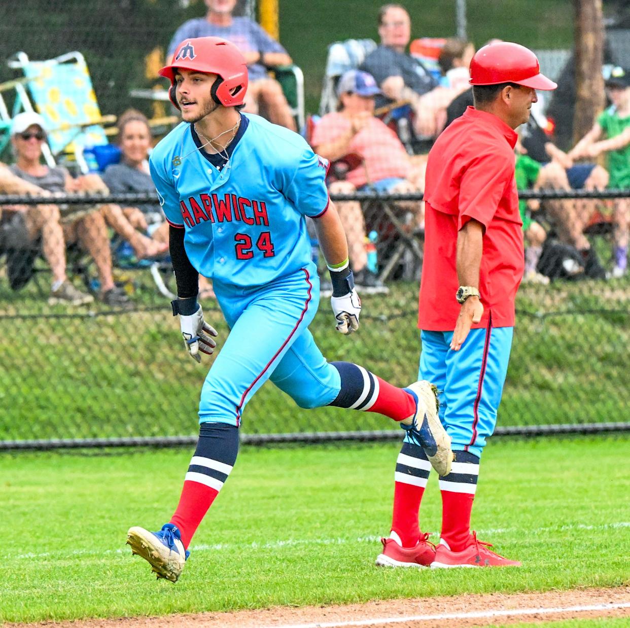 Harwich's Aiden Robbins rounds third base after hitting a two-run homer against Orleans in a July 25, 2025, Cape Cod League baseball game.