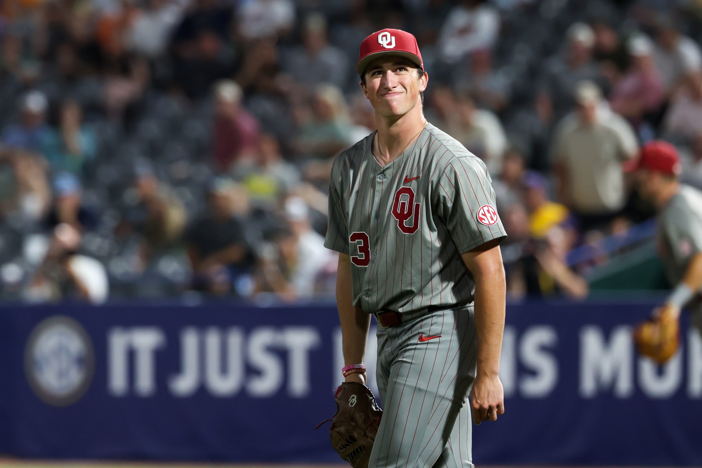 HOOVER, AL - MAY 22: Oklahoma pitcher Cade Crossland (23) shows his frustration after mishandling a bunt during the SEC Softball Tournament Quarterfinals game between Oklahoma Sooners and Vanderbilt Commodores on May 22, 2025, at Hoover Metropolitan Stadium in Hoover, Alabama. (Photo by David Buono/Icon Sportswire via Getty Images)