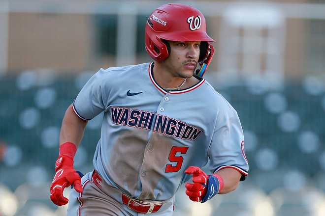 SCOTTSDALE, ARIZONA - OCTOBER 31: Seaver King #5 of the Scottsdale Scorpions runs up the line on a two-run single during an Arizona Fall League game against the Salt River Rafters at Salt River Fields at Talking Stick on October 31, 2025 in Scottsdale, Arizona. (Photo by Brandon Sloter/Getty Images)