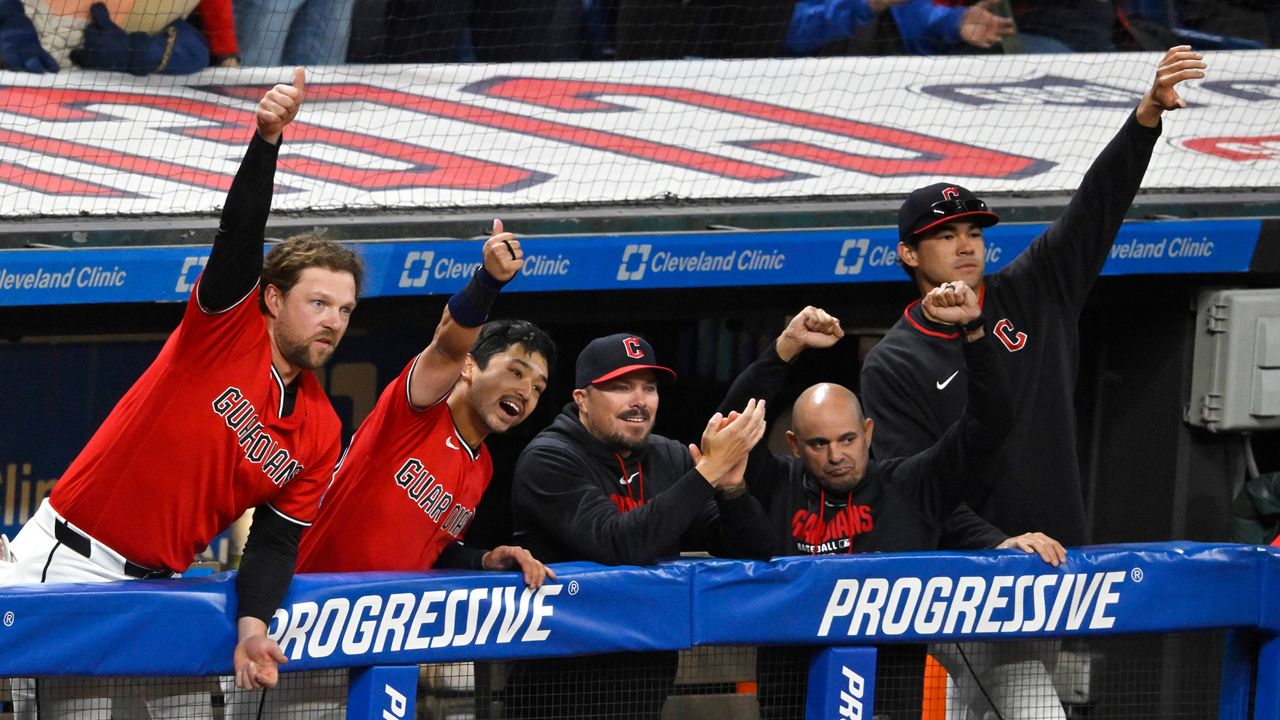 The Cleveland Guardians celebrate in the dugout after a three-RBI triple by Chase DeLauter, not pictured, in the eighth inning of a baseball game against the Houston Astros in Cleveland, Tuesday, April 21, 2026. (AP Photo/David Richard)