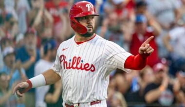 Philadelphia Phillies' Kyle Schwarber gestures at home plate after scoring on an RBI single by Nick Castellanos in the first inning of a baseball game against the New York Mets, Saturday, June 21, 2025, in Philadelphia.