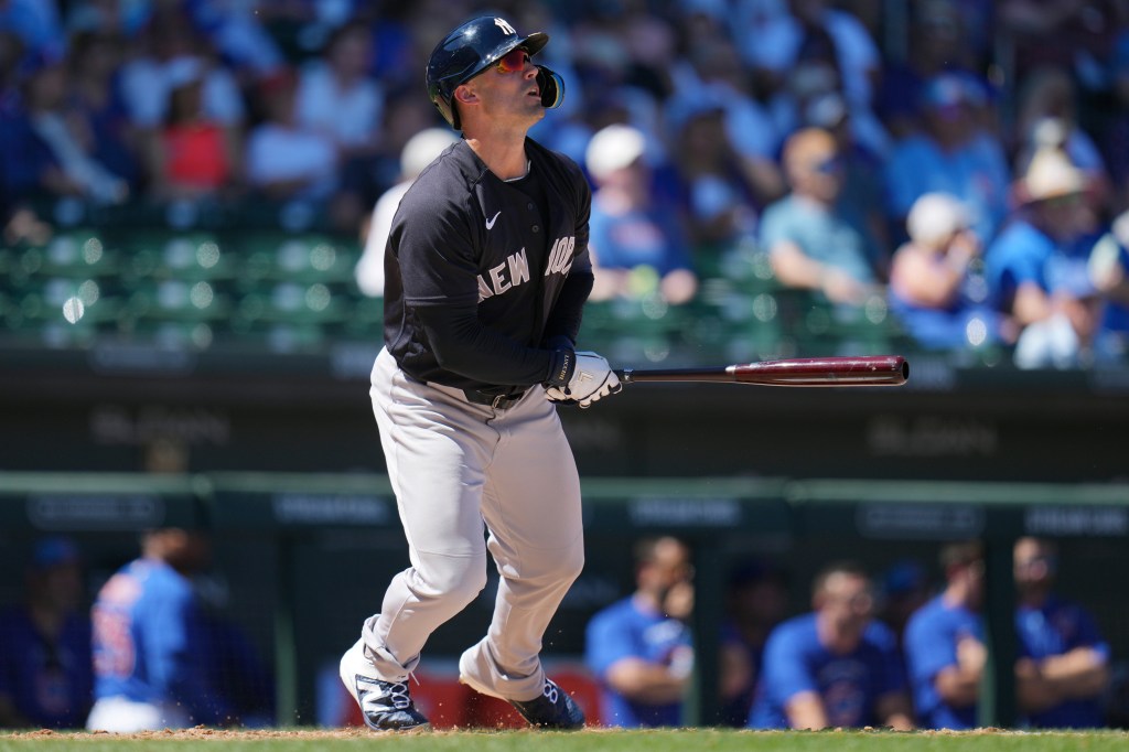 Yankees' Randal Grichuk watches the flight of his home run against the Chicago Cubs during the fourth inning of a spring training baseball game, Tuesday, March 24, 2026.