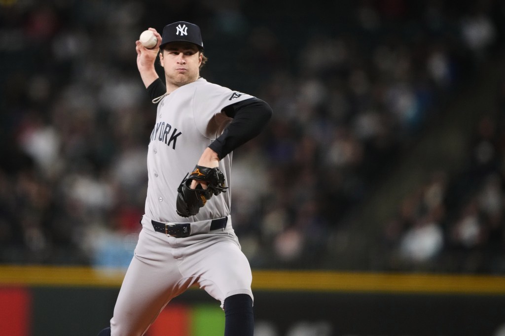 New York Yankees pitcher Cam Schlittler throws a pitch against the Seattle Mariners.