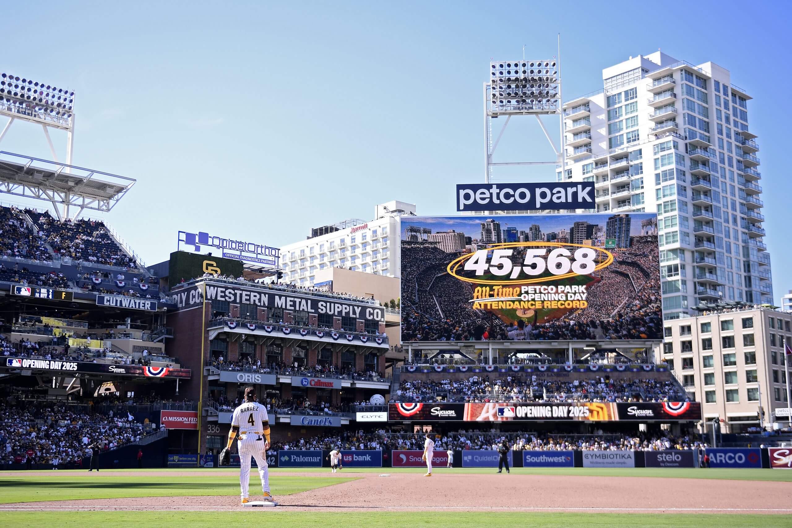 A Petco Park video board displays the park's all-time Opening Day attendance record during a live game.
