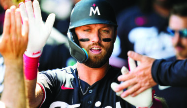 Late homers help Twins end skid against Royals