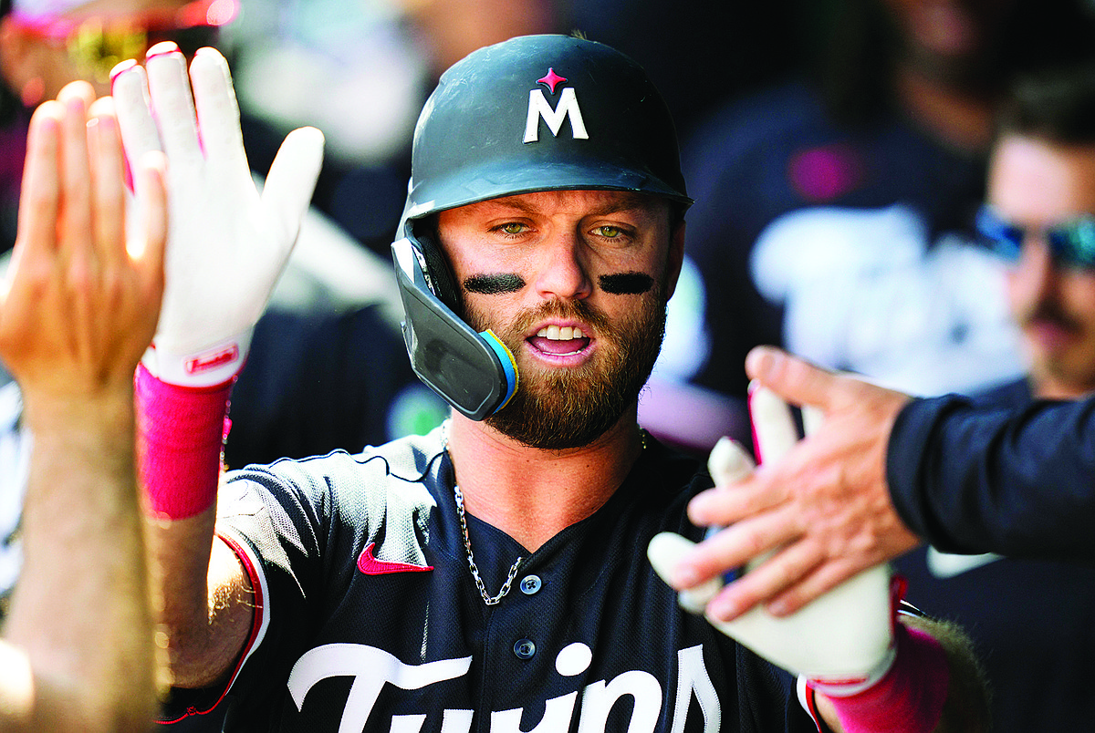 Late homers help Twins end skid against Royals