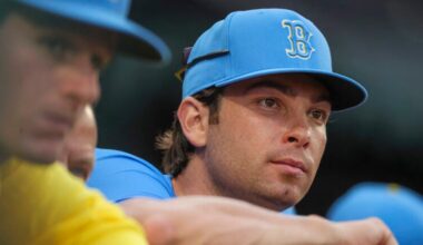 Triston Casas a Boston Red Sox player on the injured reserved list on the top step of his dugout against the Detroit Tigers during eighth inning MLB action at Fenway Park on Saturday September 27, 2025.