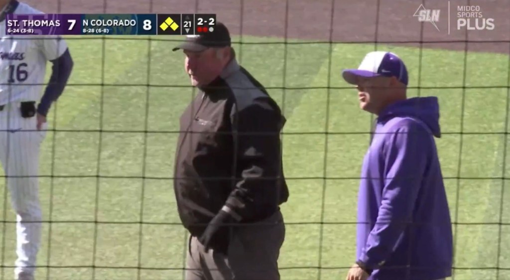 St. Thomas head coach Chris Olean (r.) protests to no avail after losing on a walk-off balk in 21 innings on April 18, 2026.