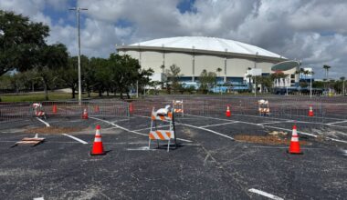 A small depression formed in Tropicana Field's parking lot. City officials said a water pipe broke and washed the dirt away. (Spectrum News/Andy Cole)