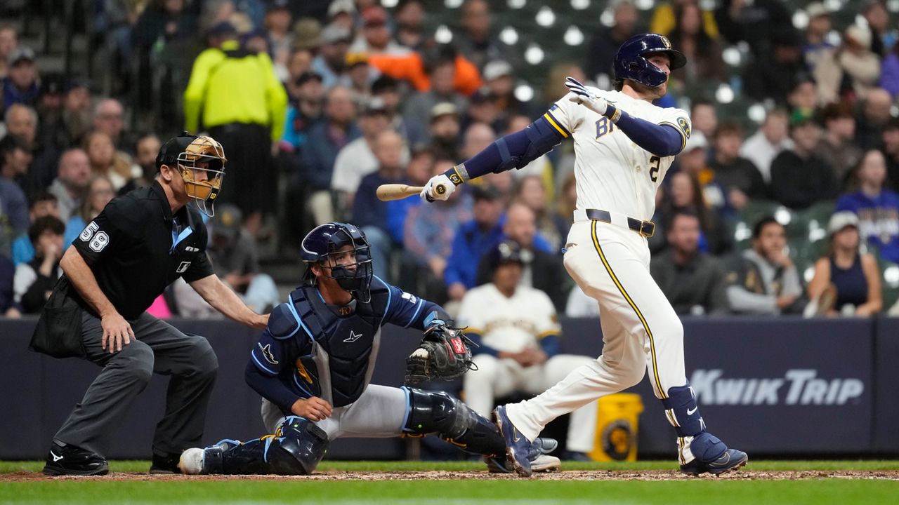 Milwaukee Brewers' Brice Turang hits a two-run single during the fifth inning of a baseball game against the Milwaukee Brewers, Tuesday, March 31, 2026, in Milwaukee.