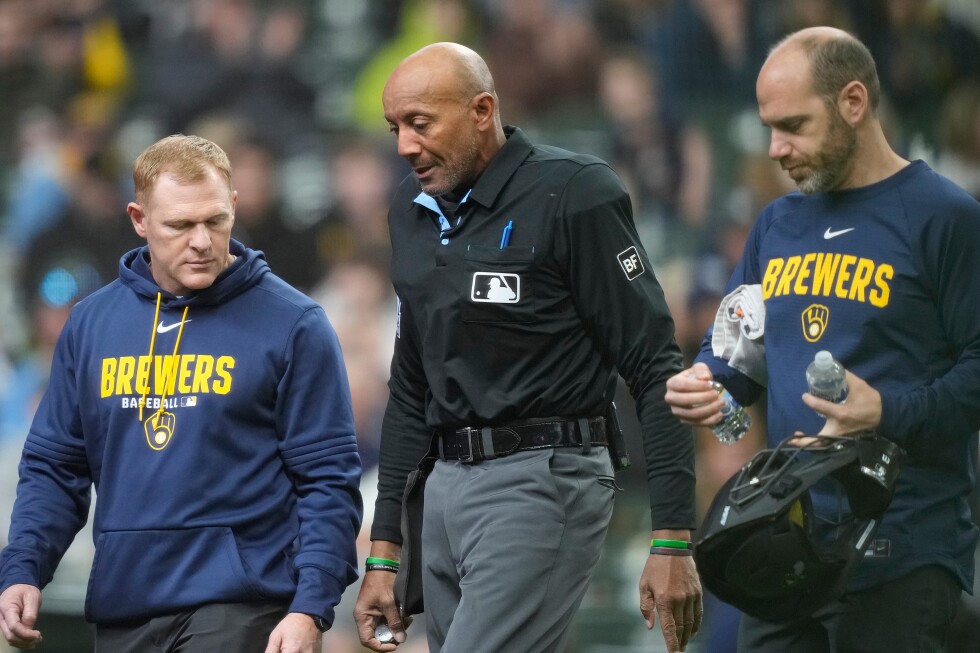 Umpire C.B. Bucknor leaves Rays-Brewers game after foul tip hits him in face mask