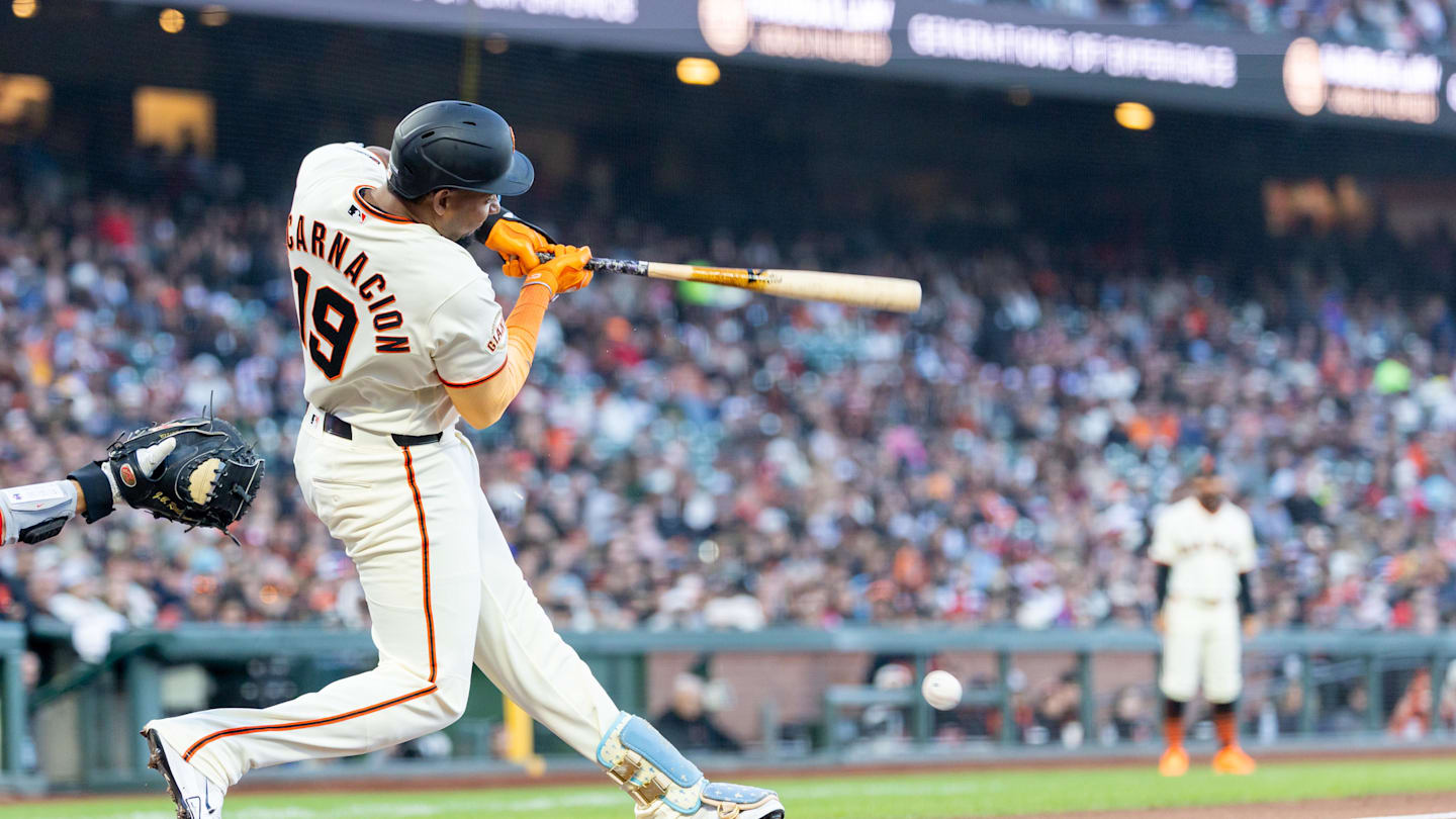 Apr 6, 2026; San Francisco, California, USA; San Francisco Giants right fielder Jerar Encarnacion (19) grounds to get on base during the second inning against the Philadelphia Phillies at Oracle Park. Mandatory Credit: Bob Kupbens-Imagn Images