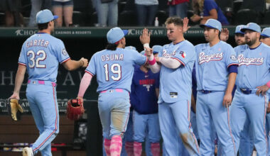 May 10, 2026; Arlington, Texas, USA; Texas Rangers first baseman Joc Pederson (3) points to center fielder Evan Carter (32) as he walks off the field after defeating the Chicago Cubs at Globe Life Field. Mandatory Credit: Raymond Carlin III-Imagn Images