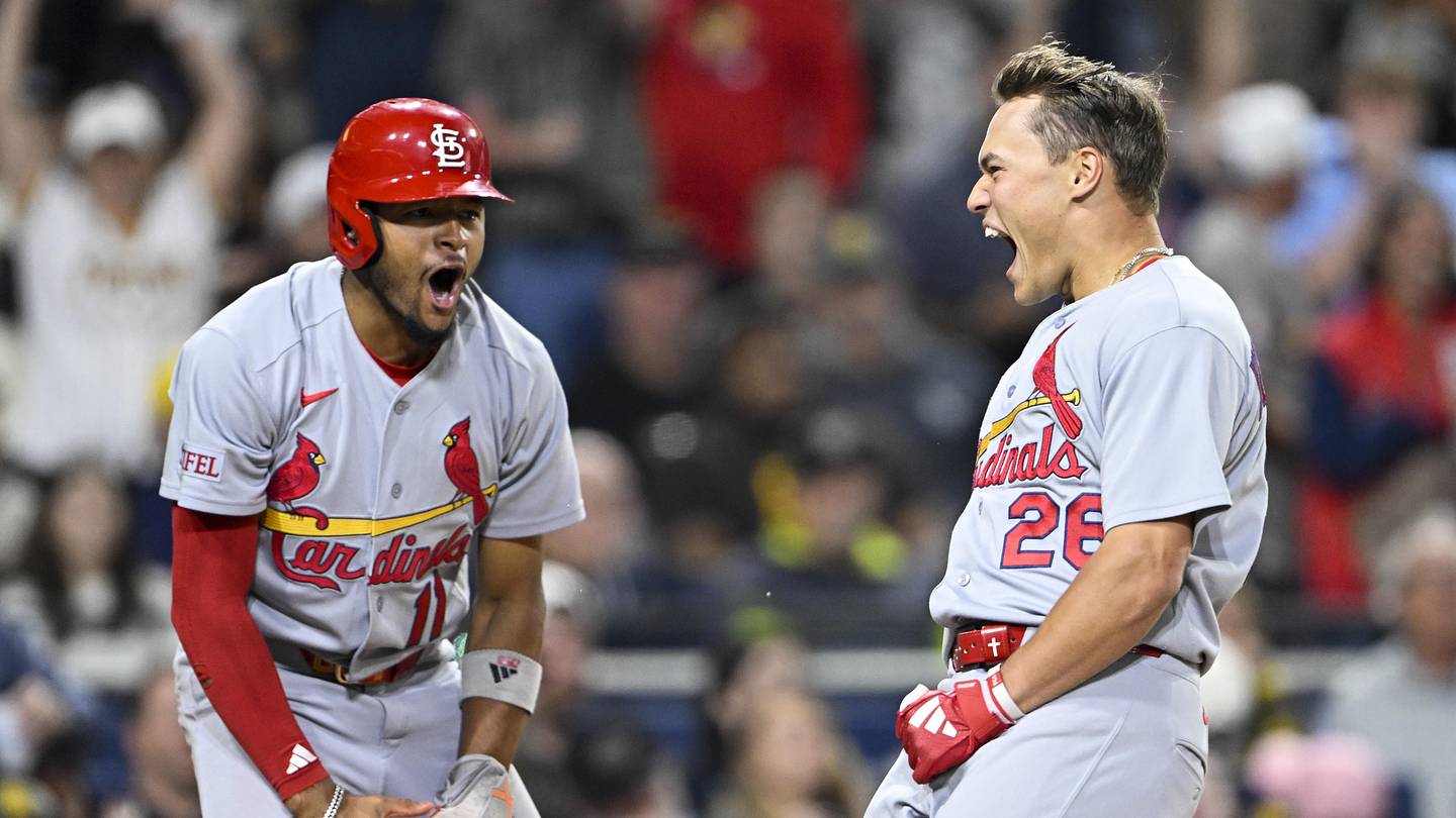 May 8, 2026; San Diego, California, USA; St. Louis Cardinals second baseman JJ Wetherholt (26), right, celebrates with center fielder Victor Scott II (11) after scoring during the fifth inning against the San Diego Padres at Petco Park. Mandatory Credit: Denis Poroy-Imagn Images