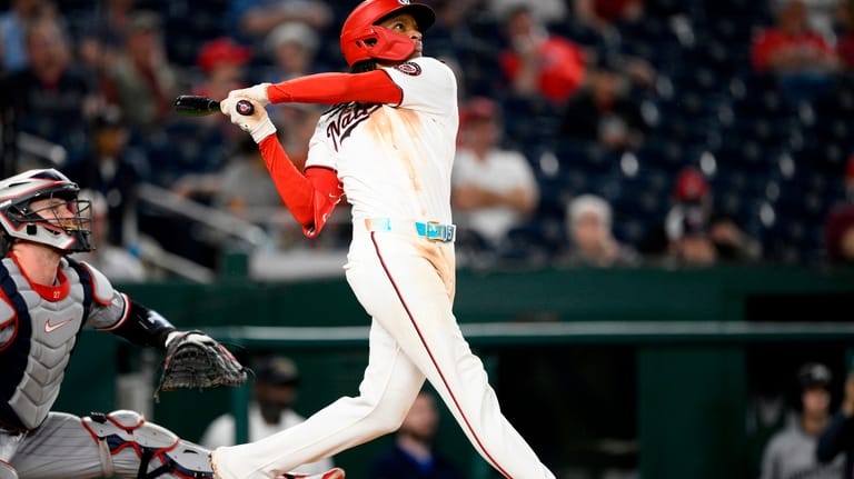 Washington Nationals' CJ Abrams follows through on his grand slam...