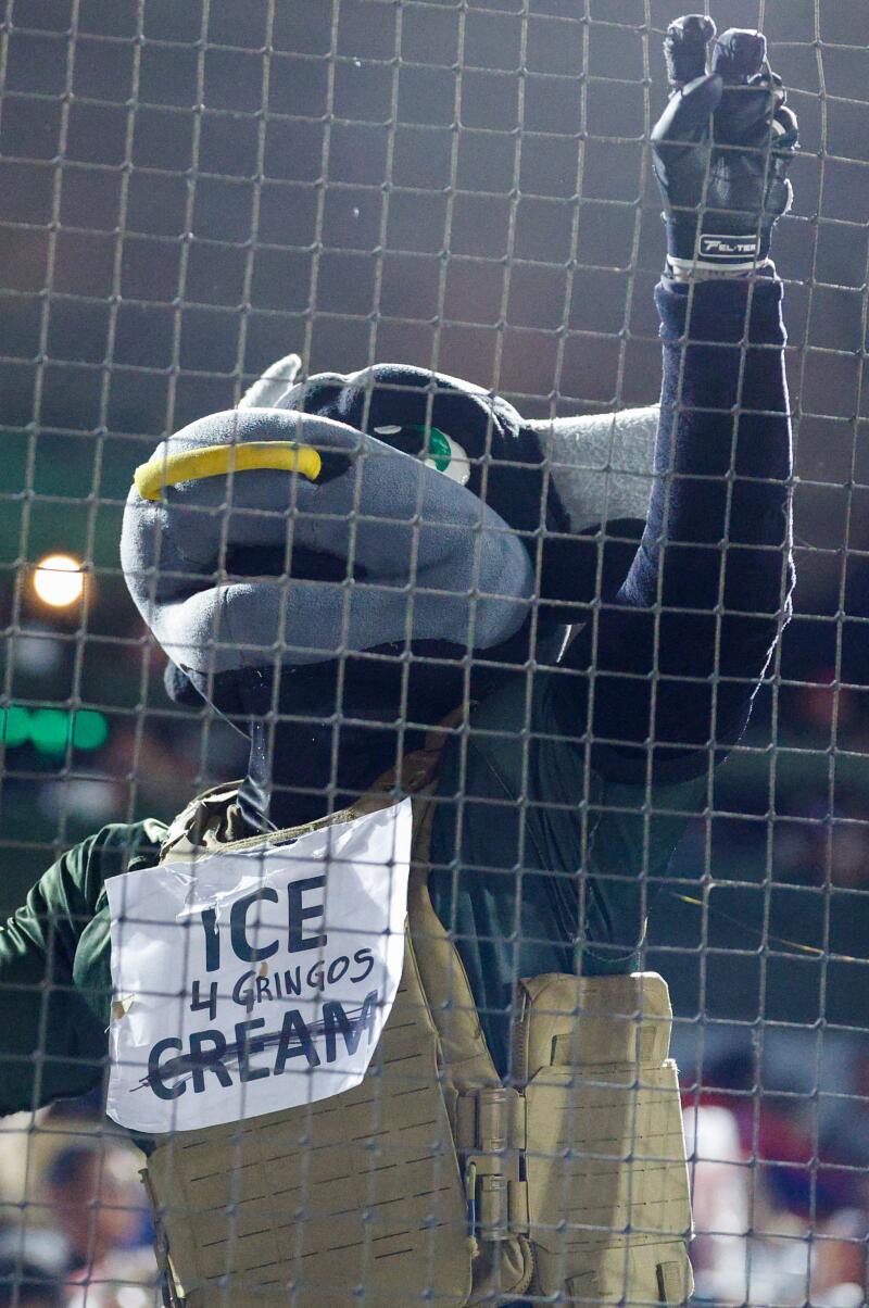 Mascot Toron dresses up as a U.S. Immigration and Customs Enforcement officer. 