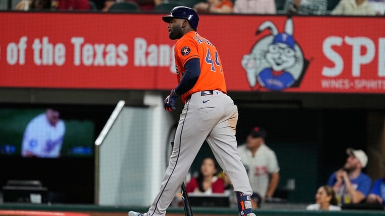 Houston Astros' Yordan Alvarez walks out of the batters box...