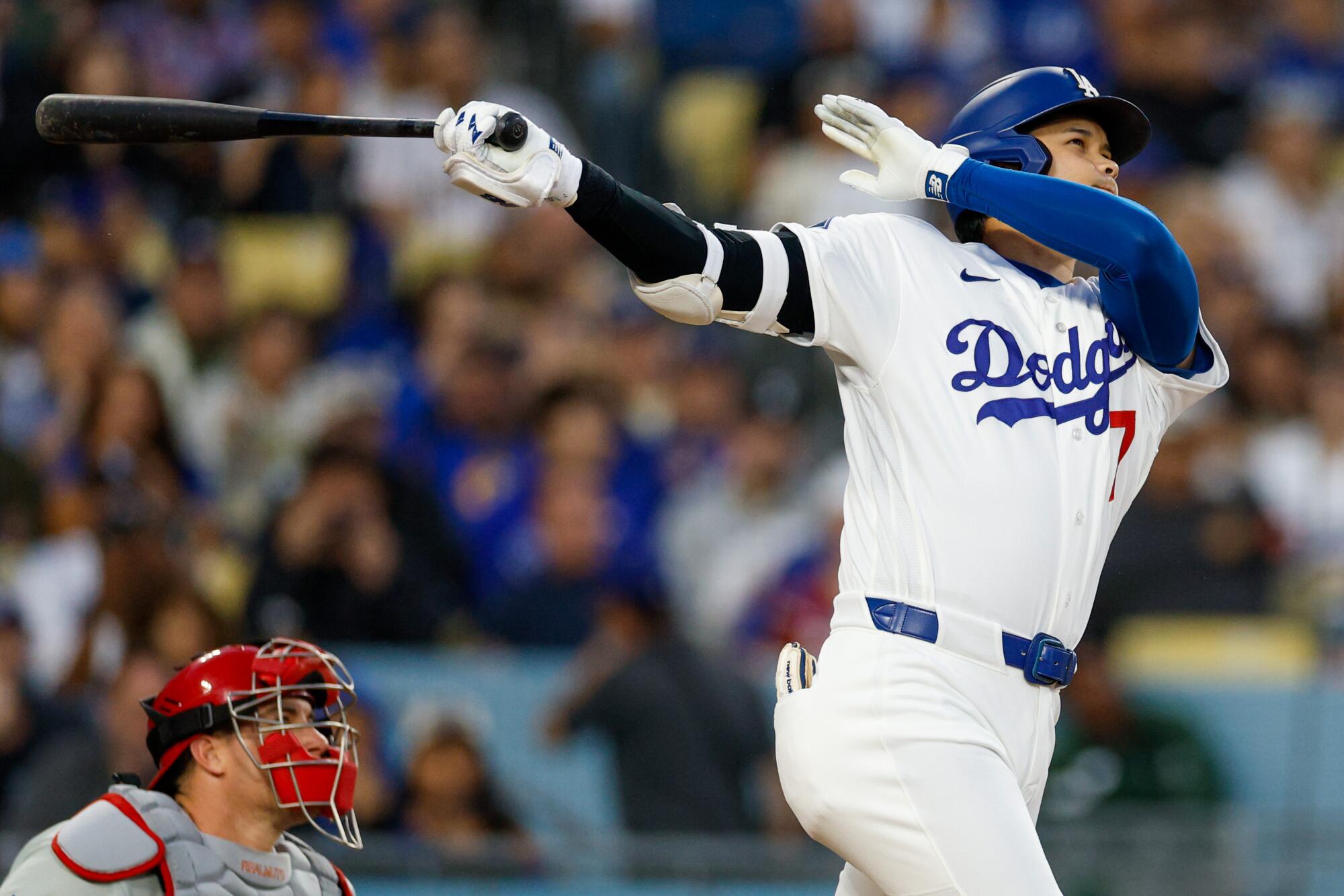Dodgers star Shohei Ohtani hits a solo home run in the third inning Friday against Philadelphia.