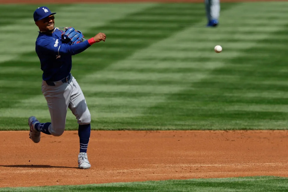 Apr 3, 2026; Washington, District of Columbia, USA; Los Angeles Dodgers shortstop Mookie Betts (50) fields a ground ball by Washington Nationals second baseman Luis Garc?a Jr. (not pictured) during the first inning at Nationals Park. Mandatory Credit: Geoff Burke-Imagn Images