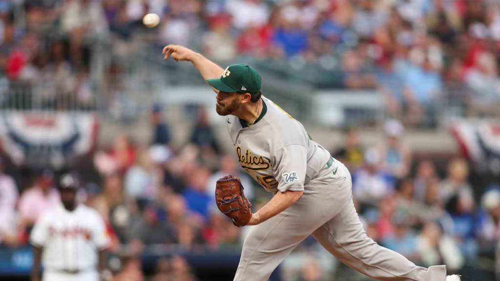 Athletics starting pitcher Aaron Civale (45) throws against the Atlanta Braves in the first inning at Truist Park.