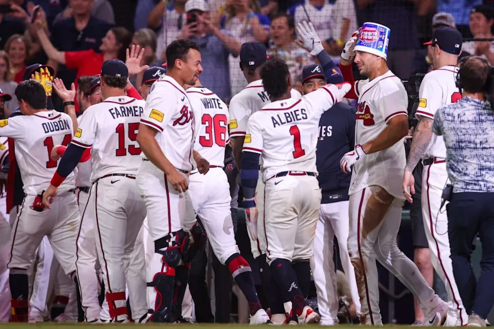 Atlanta Braves first baseman Matt Olson (28) celebrates with teammates after a walk-off two-run home run against the Detroit Tigers in the ninth inning at Truist Park.