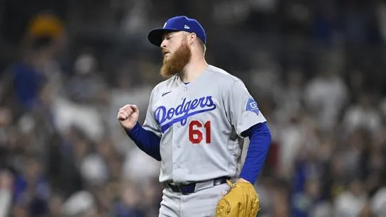 Los Angeles Dodgers pitcher Will Klein (61) pumps his fist after the Dodgers beat the San Diego Padres at Petco Park.