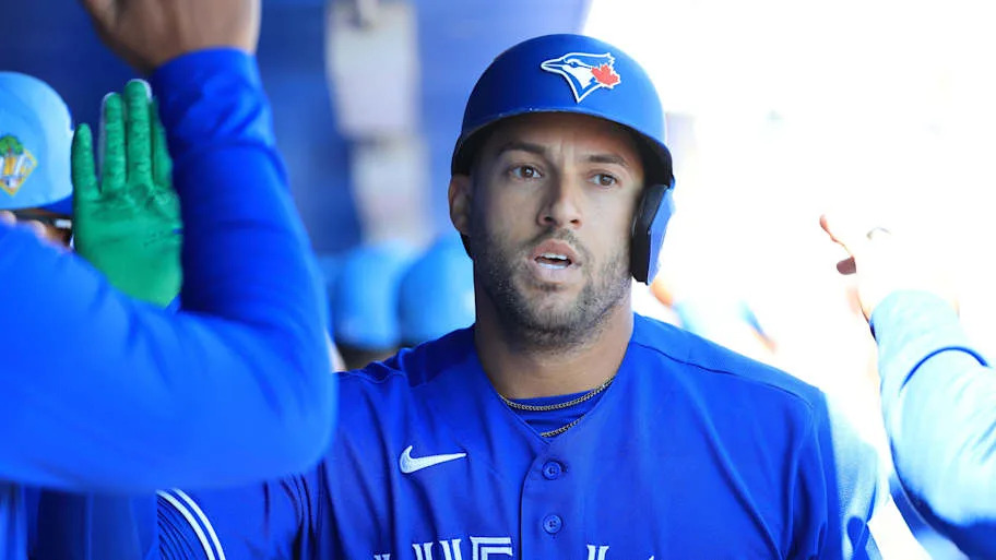 Toronto Blue Jays designated hitter George Springer celebrates with his teammates.