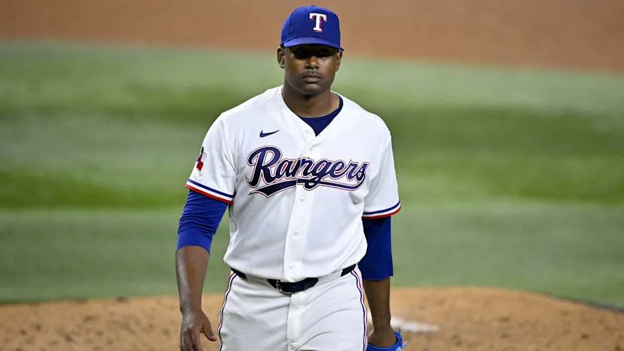 Texas Rangers starting pitcher Kumar Rocker leaves the field.