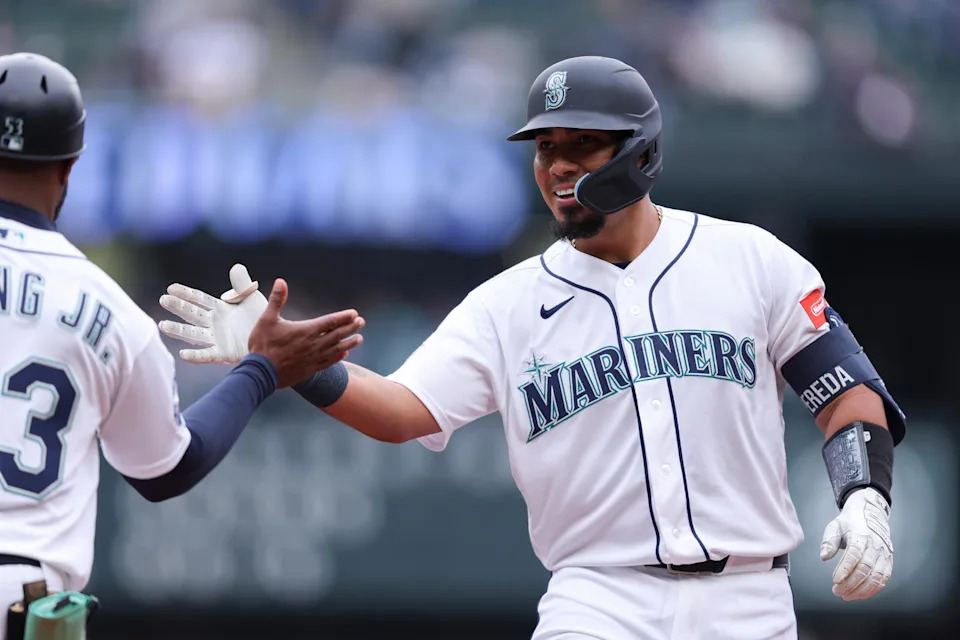 Seattle Mariners catcher Jhonny Pereda (right) reacts after hitting a single during a game against the Atlanta Braves on May 6 at T-Mobile Park in Seattle. | Kevin Ng/Imagn IMages.