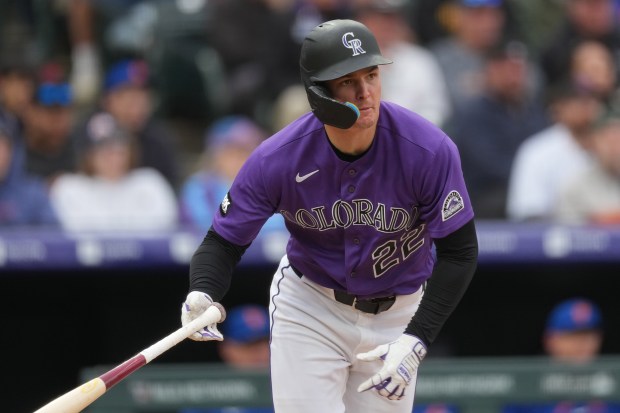 The Rockies' Mickey Moniak heads up the first base line after hitting a triple off New York Mets relief pitcher Craig Kimbrel in the eighth inning of a baseball game Monday, May 4, 2026, in Denver. (AP Photo/David Zalubowski)