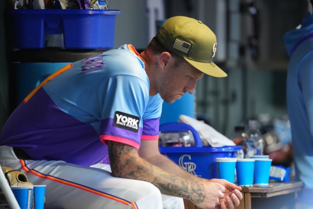 Colorado Rockies starting pitcher Kyle Freeland sits in the dugout after being pulled from the mound after giving up a walk to Arizona Diamondbacks' Nolan Arenado in the fourth inning of a baseball game Friday, May 15, 2026, in Denver. (AP Photo/David Zalubowski)